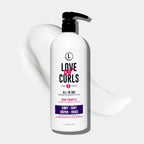 Bottle of 'Love ur Curls' hair care product on a white background