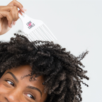 the new volumizing hair pick from love ur curls lus brands used by a model placed on her hair