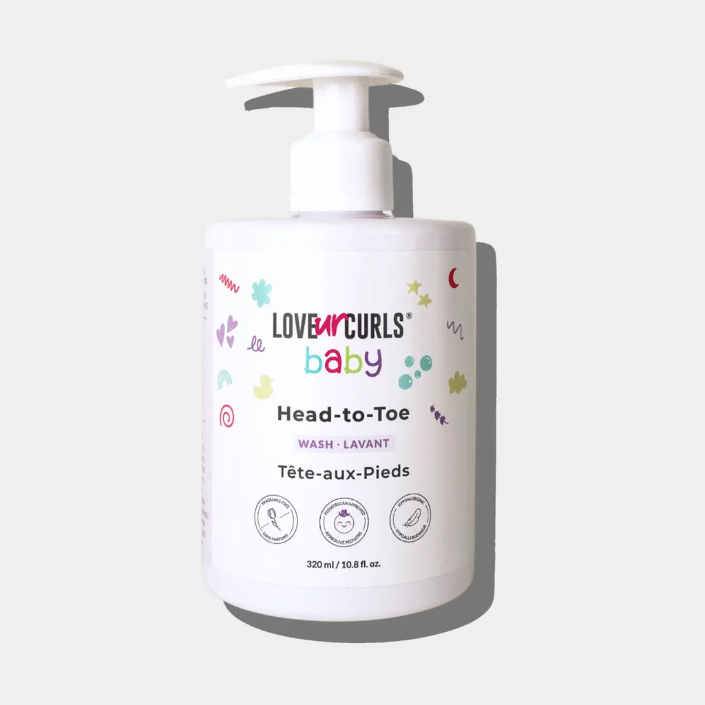 A white pump bottle labeled 'LOVE CURLS baby Head-to-Toe' with colorful graphic elements and text indicating it is a baby wash product.